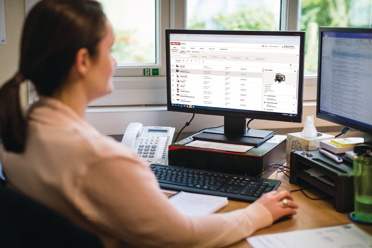 Female employee in front of desktop using ON!Track, 3rd generation