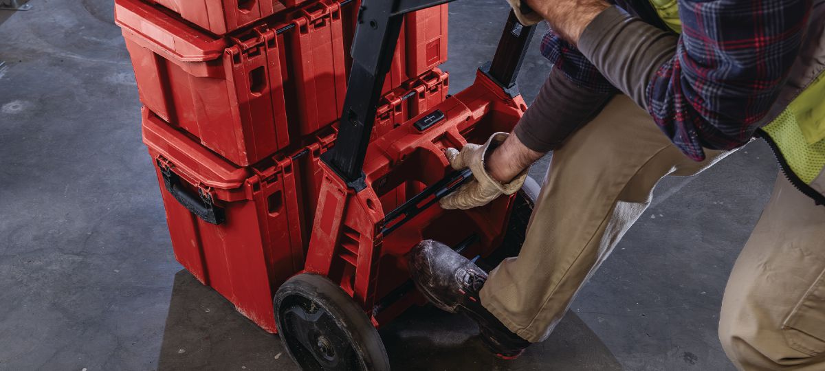 Cropped application picture of a worker removing the Trolley from the ProKit Modular Storage System.