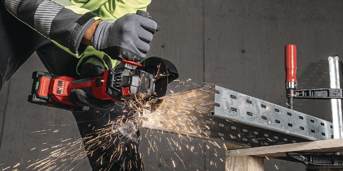 Cropped application picture of the cordless angle grinder AG 4S-22. Metal cutting application, cable tray.